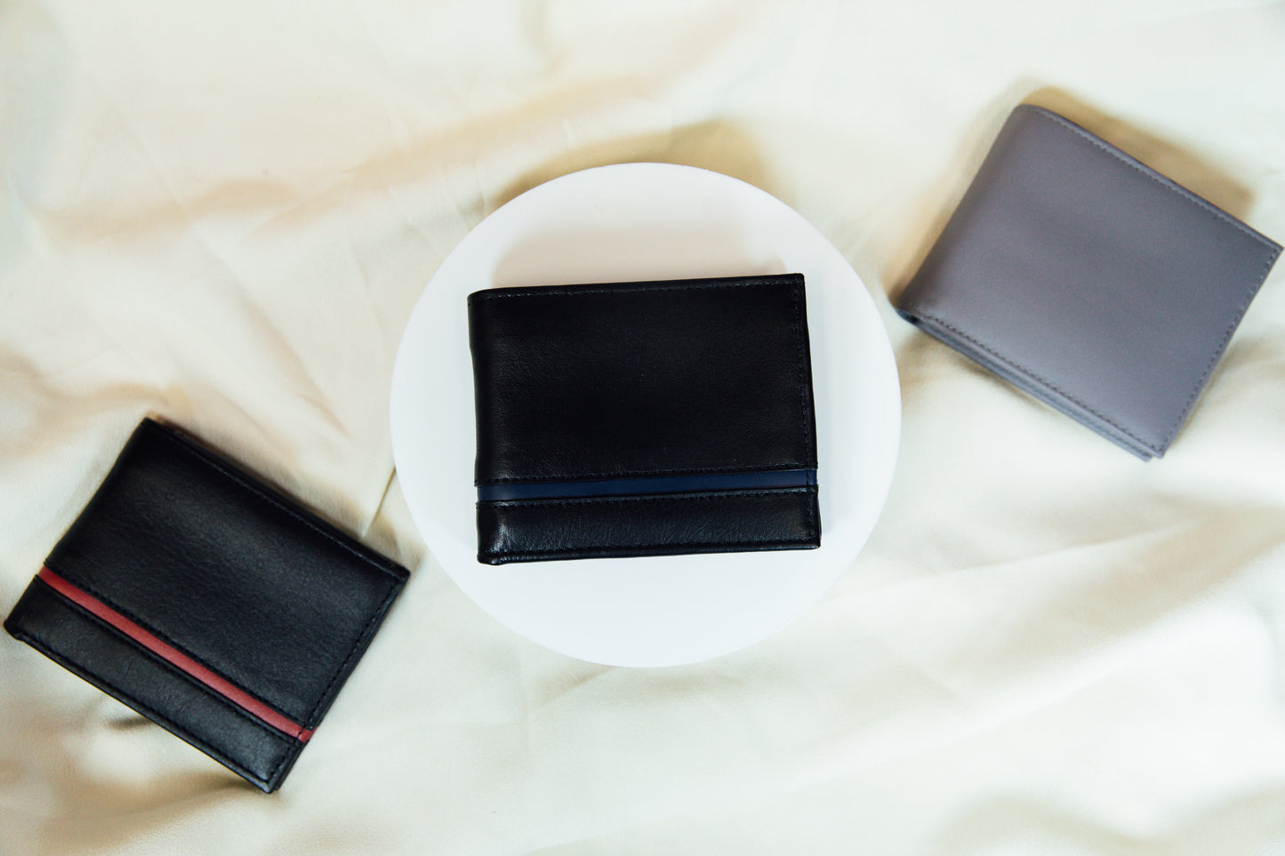 An exterior view of the black and blue Carry-It-All Leather Bifold Wallet