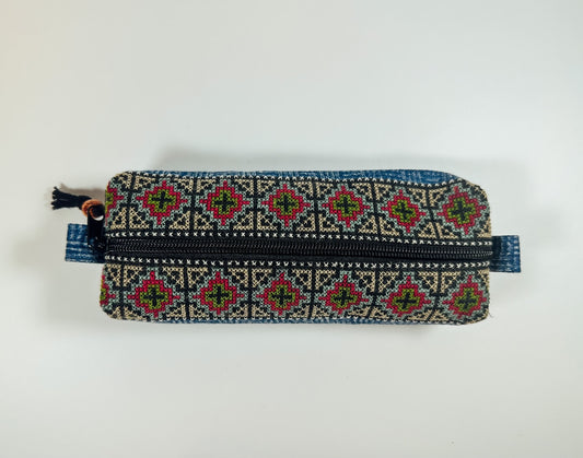 A vibrant Thai Tribal Pencilcase with a geometric pattern and a metal zipper.
