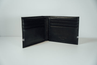 An interior view of the black and grey Slim Bifold Leather Wallet from John Candor at Hope's Gate