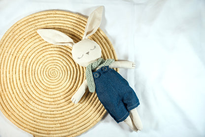 A Bunny Stuffed animal wearing a green scarf and blue jumpsuit from Hope's Gate