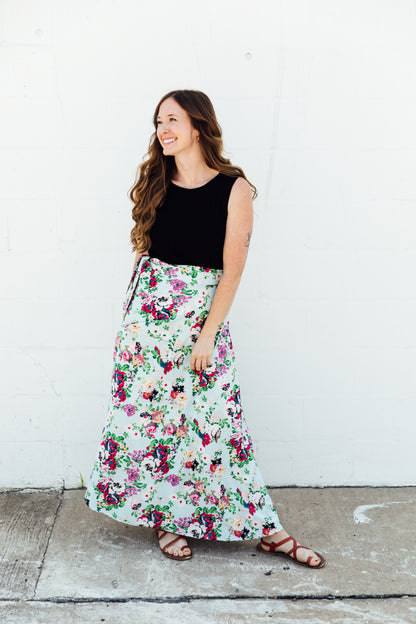 A women wear a blue floral maxi wrap skirt