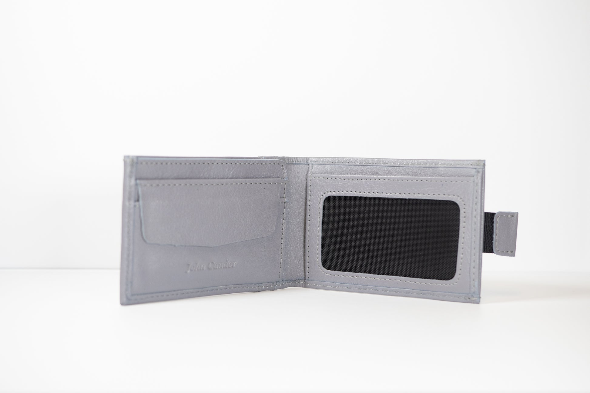 An interior view of the the Gray Pull Tab Leather Wallet from John Candor at Hope's Gate