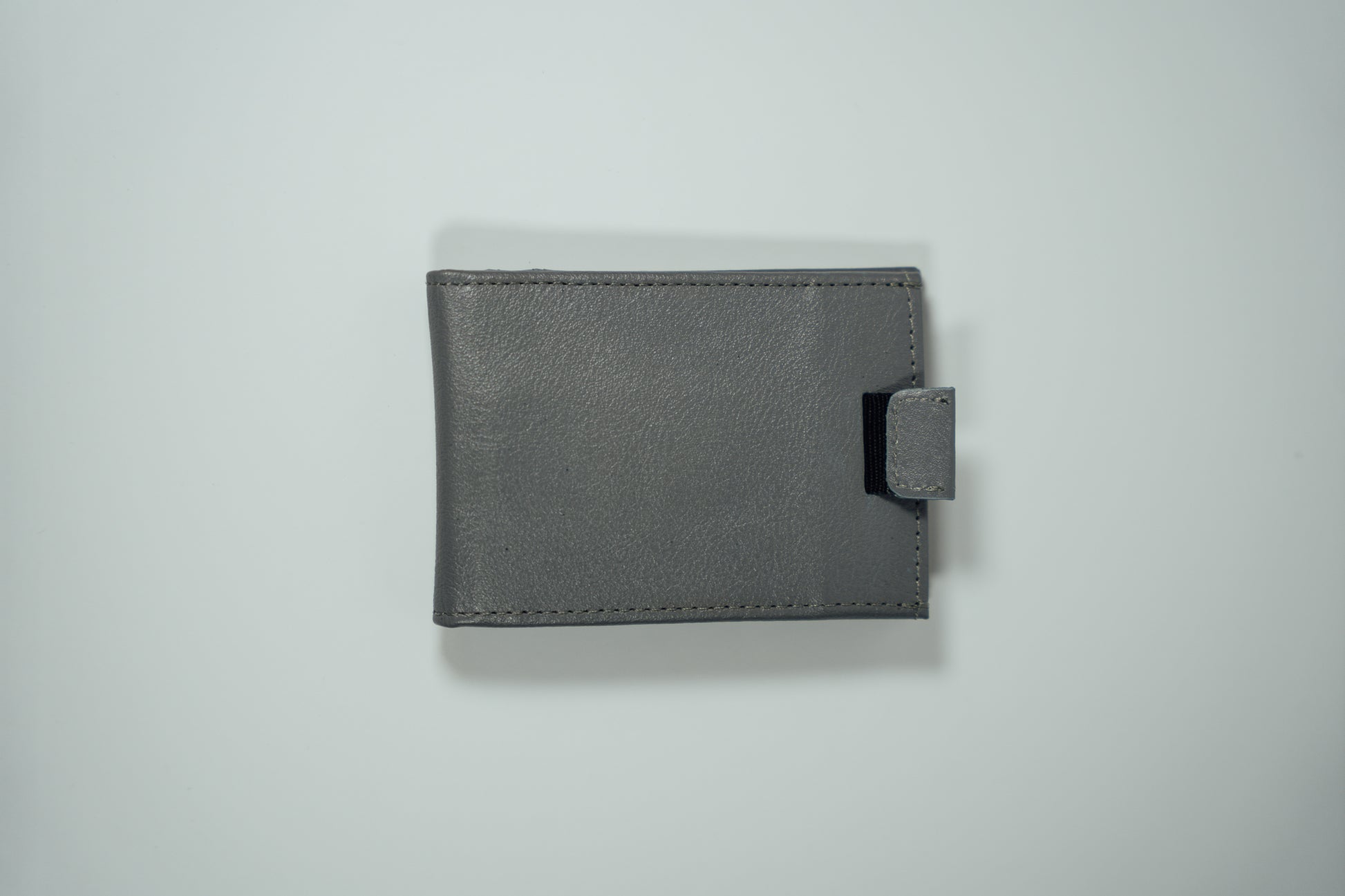 An exterior view of the the Gray Pull Tab Leather Wallet from John Candor at Hope's Gate 